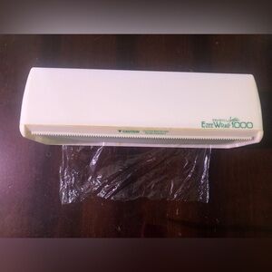 - Wall Mounted Saran Wrap Dispenser.